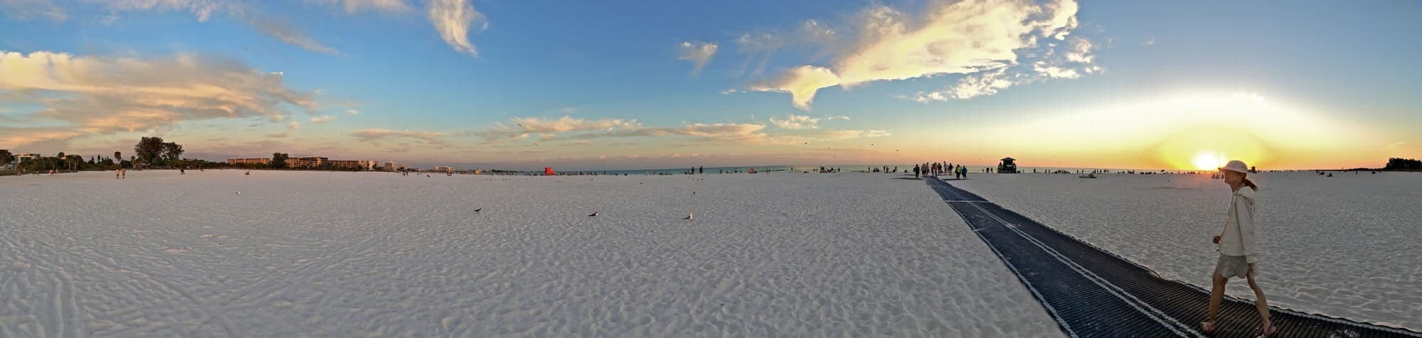 A panorama of Siesta Beach on Siesta Key at sunset