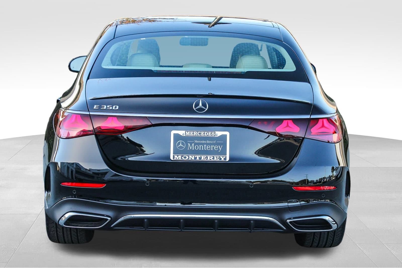 Black Mercedes-Benz executive sedan staged for a private jet arrival at a Tampa Bay FBO